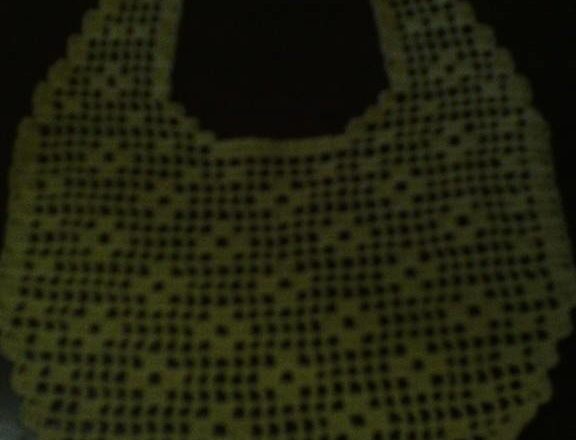 Filet crochet baby bib with small flowers photo author Facebook User Maria Lennaco